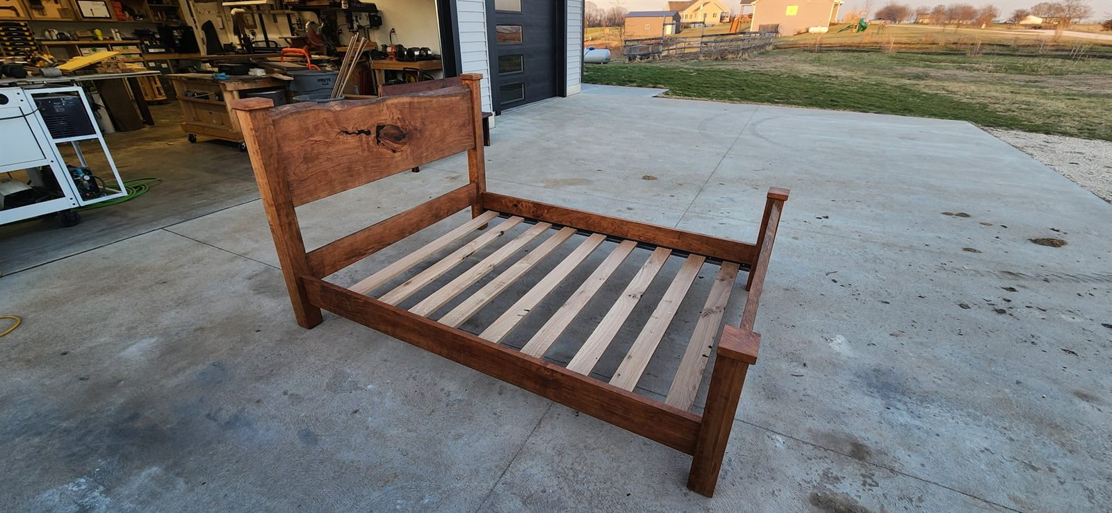 Cherry bed frame with a live edge headboard