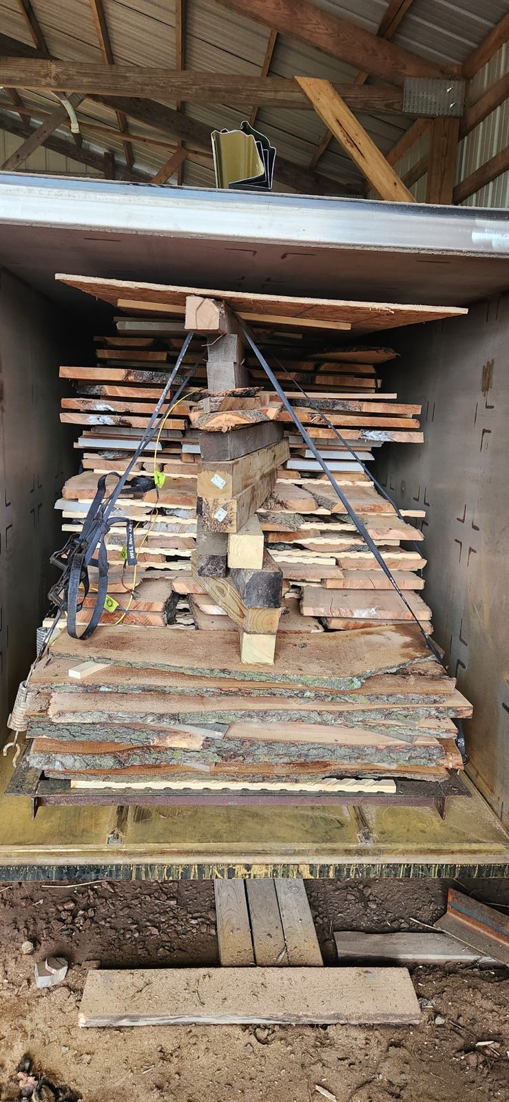 Stickered walnut slabs strapped and loaded in the IDry vacuum kiln