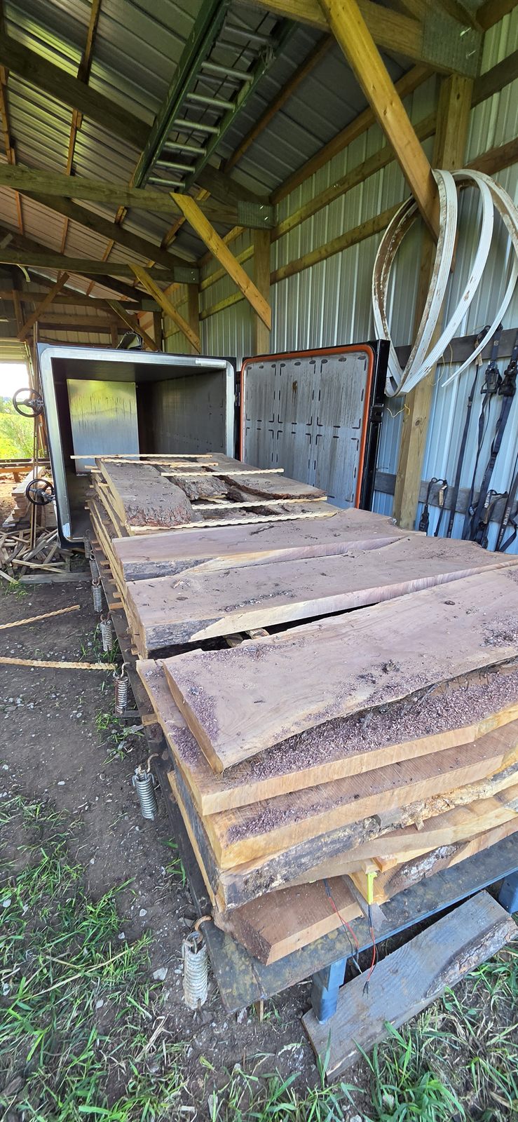 Loading a cart of stickered slabs into the vacuum kiln