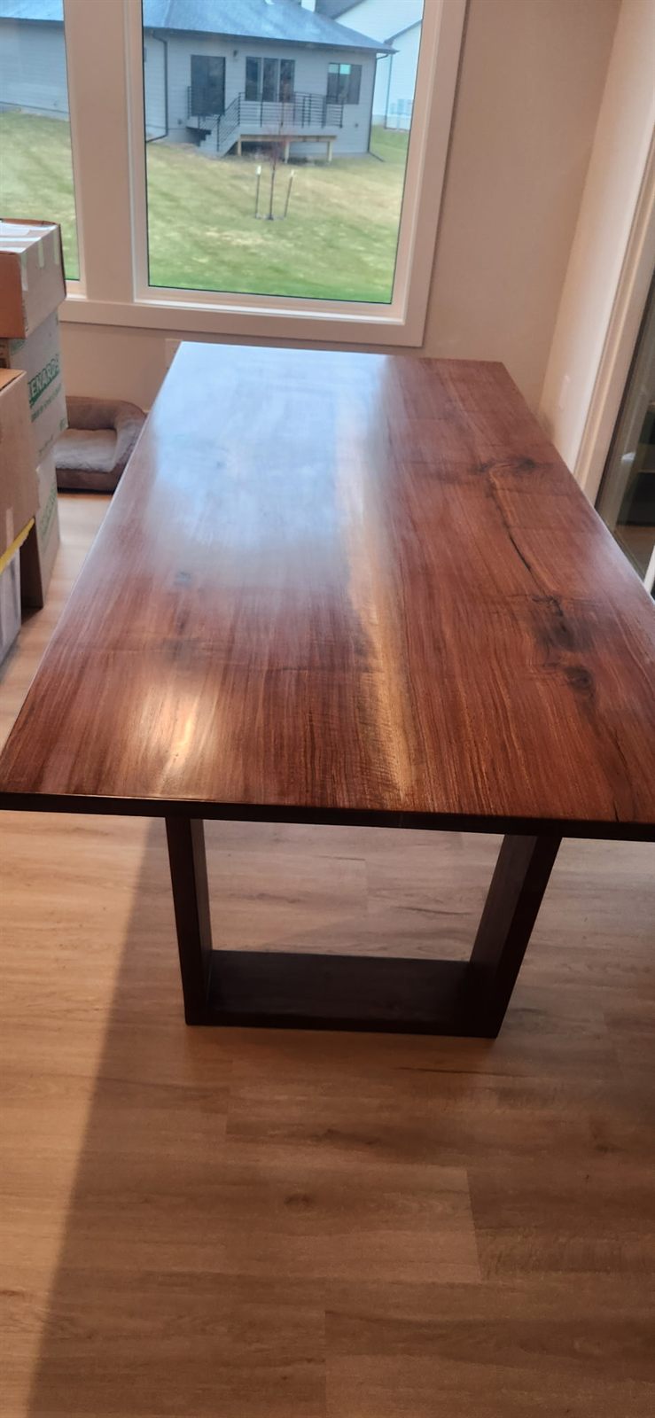 Black walnut dining table installed in a customer home