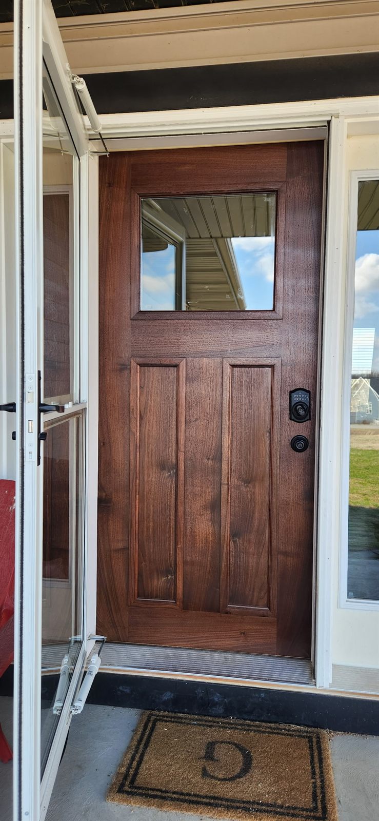 Custom black walnut entry door built by Indianola Sawmill